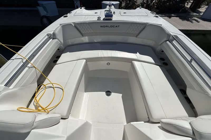 Slide: The Image of 2024 World Cat 296 DC boat interior with white seating and yellow rope. - 13