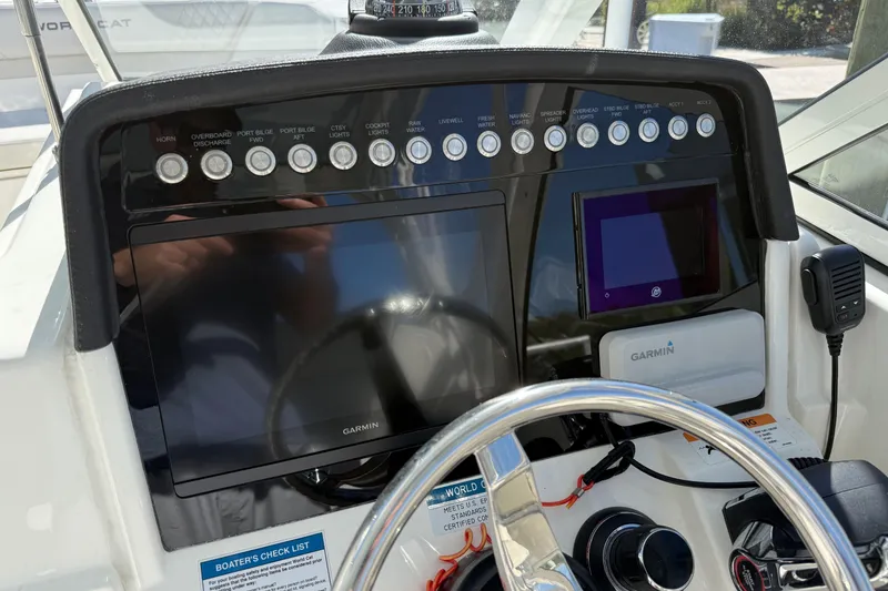 Slide: The Image of 2024 World Cat 296 DC dashboard with Garmin navigation and control panel. - 14