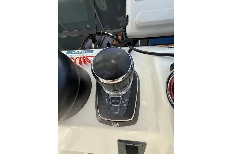 Slide: The Image of 2024 World Cat 296 DC boat control panel with joystick and buttons. - 15