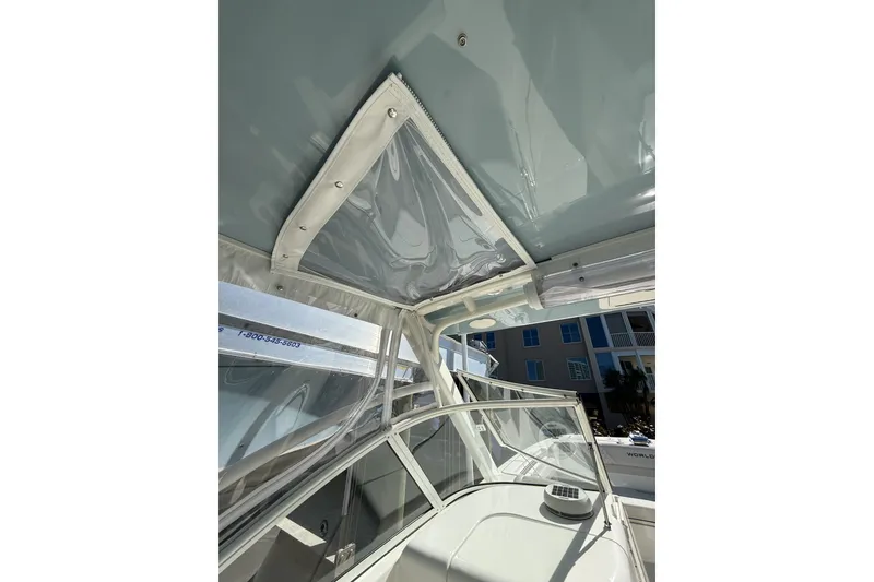 Slide: The Image of 2024 World Cat 296 DC boat interior with clear canopy and modern design. - 19