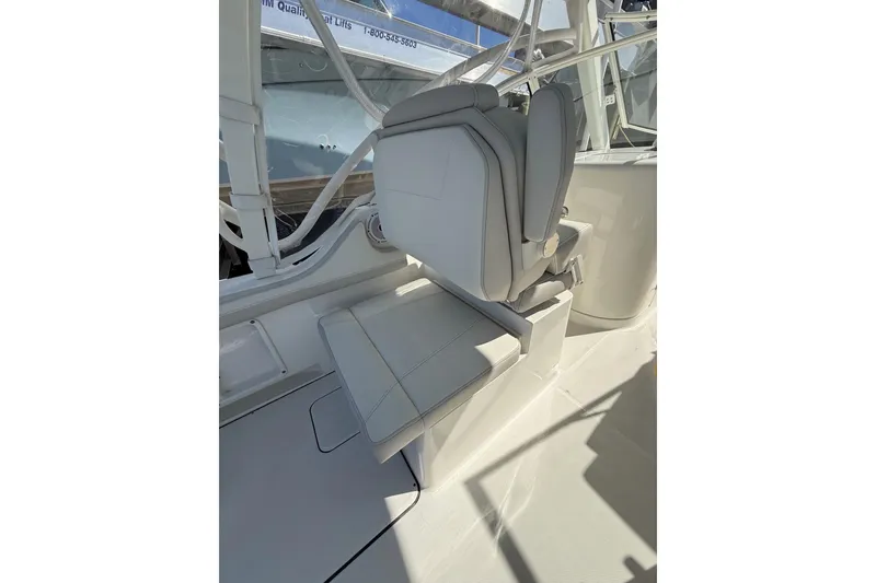 Slide: The Image of 2024 World Cat 296 DC boat seat, featuring sleek white upholstery and modern design. - 22