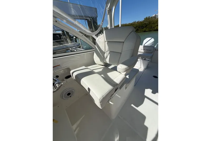 Slide: The Image of 2024 World Cat 296 DC boat interior with luxurious white seating. - 24
