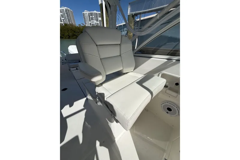 Slide: The Image of 2024 World Cat 296 DC boat seat with luxurious white upholstery. - 26