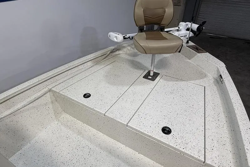 Slide: The Image of 2022 Express H190B boat interior with beige seat and storage compartments. - 13