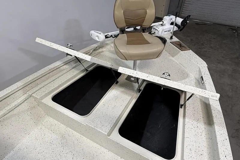 Slide: The Image of 2022 Express H190B boat interior with storage compartments and swivel seat. - 14