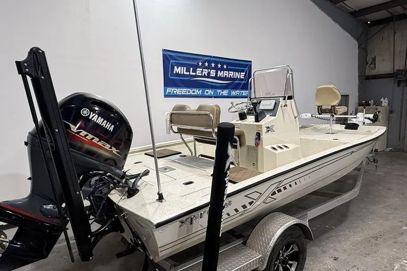 Slide: The Image of 2022 Express H190B boat with Yamaha engine at Miller's Marine showroom. - 3