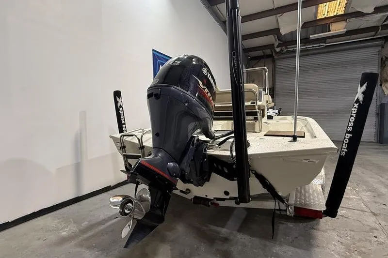 Slide: The Image of 2022 Express H190B boat with Yamaha outboard motor in a garage setting. - 4