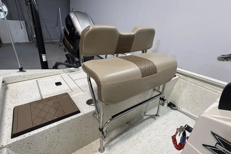 Slide: The Image of 2022 Express H190B boat seat with beige upholstery and stainless steel frame. - 6
