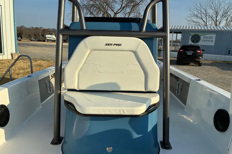 Slide: The Image of 2026 Sea Pro 250 Bay boat interior with white seating and sturdy frame. - 10