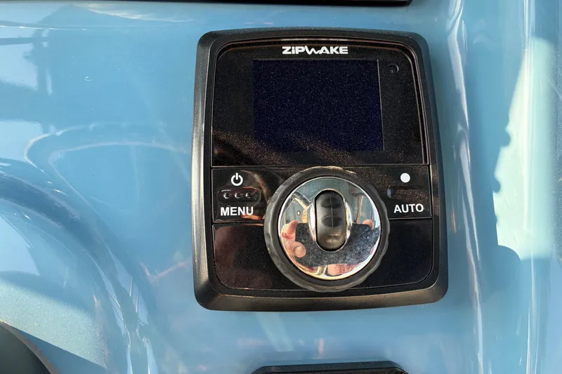 Slide: The Image of Zipwake control panel on 2026 Sea Pro 250 Bay boat dashboard. - 15