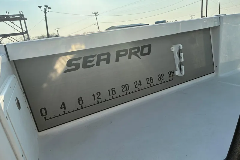 Slide: The Image of 2026 Sea Pro 250 Bay boat with integrated measuring scale on deck. - 21