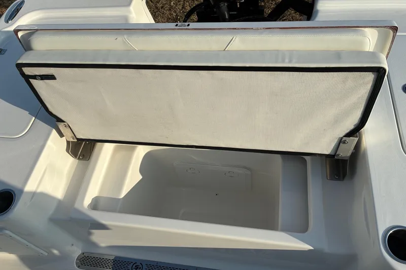 Slide: The Image of 2026 Sea Pro 250 Bay boat seat with storage compartment open. - 25