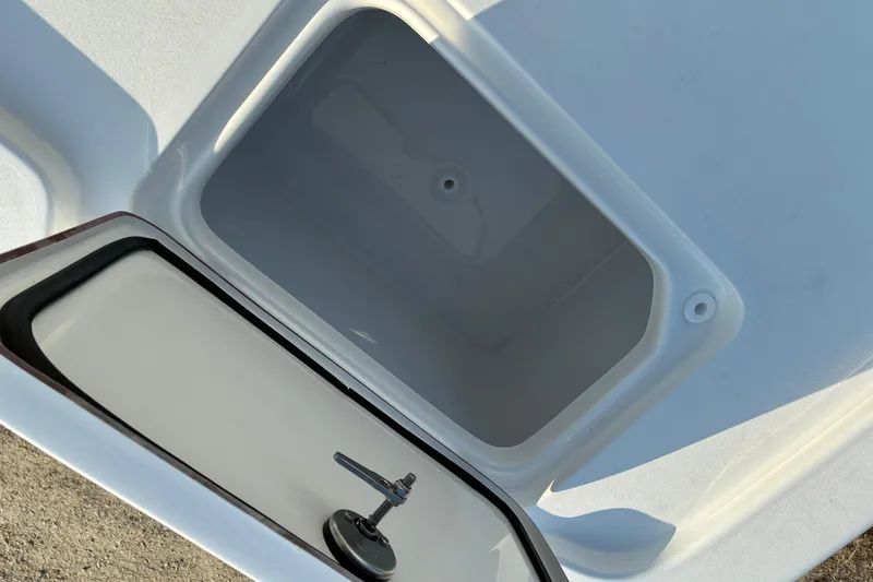 Slide: The Image of Open storage compartment on 2026 Sea Pro 250 Bay boat, showcasing interior space. - 28