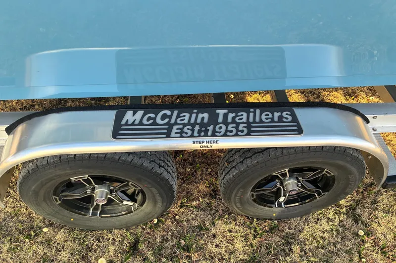 Slide: The Image of Trailer with McClain Trailers logo, supporting a 2026 Sea Pro 250 Bay boat. - 5