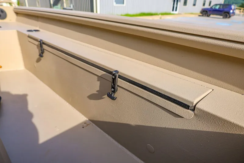 Slide: The Image of Interior view of 2026 Excel Switchblade boat, showcasing storage compartment and sleek design. - 11