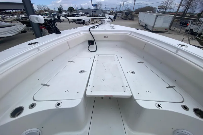 Slide: The Image of 2021 Sea Hunt Gamefish 27 Forward Seating boat interior, showcasing spacious deck layout. - 11