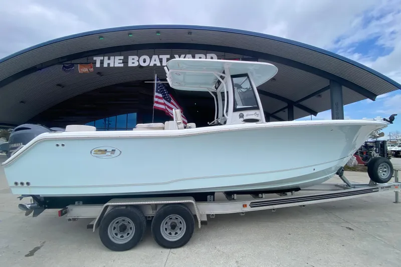 Slide: The Image of 2021 Sea Hunt Gamefish 27 boat on trailer at The Boat Yard. - 2
