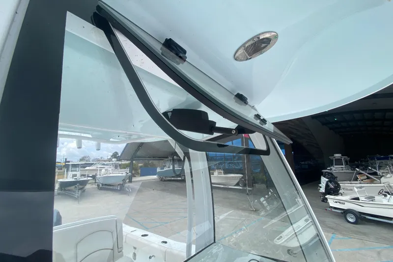 Slide: The Image of 2021 Sea Hunt Gamefish 27 Forward Seating boat windshield and wiper detail. - 20