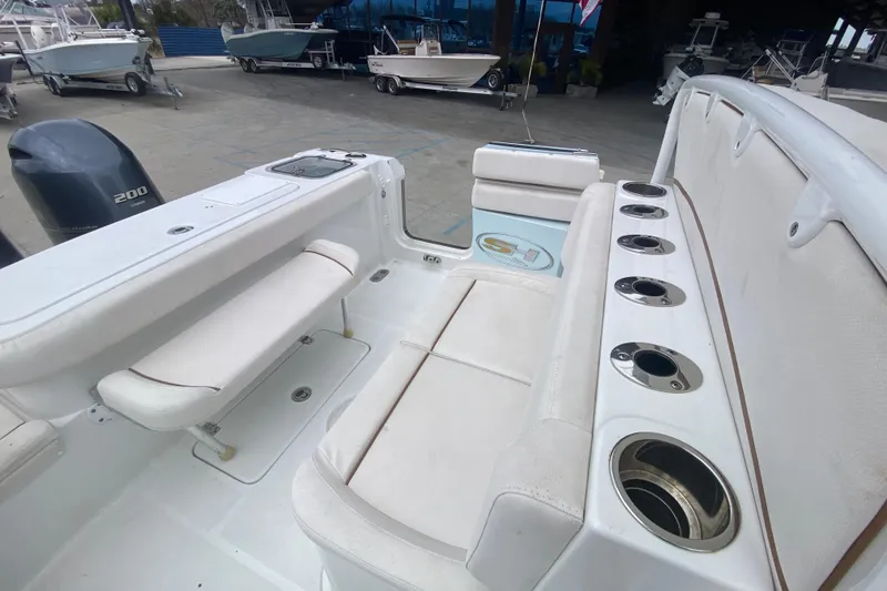 Slide: The Image of 2021 Sea Hunt Gamefish 27 Forward Seating boat interior with rod holders and seating. - 27