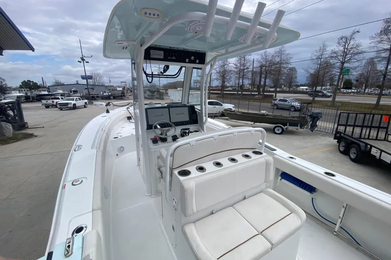 Slide: The Image of 2021 Sea Hunt Gamefish 27 boat with forward seating, docked at a marina. - 30