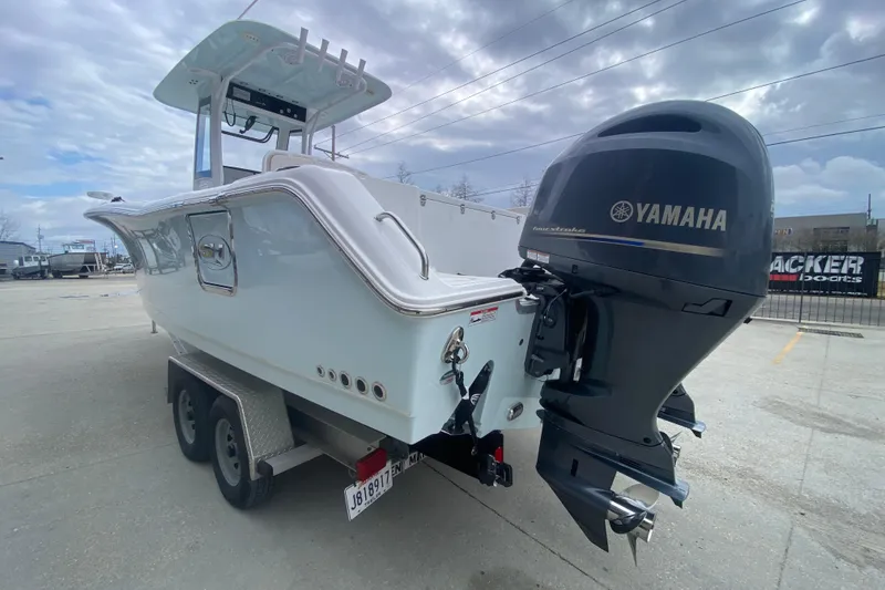 Slide: The Image of 2021 Sea Hunt Gamefish 27 boat with Yamaha outboard motor on trailer. - 5