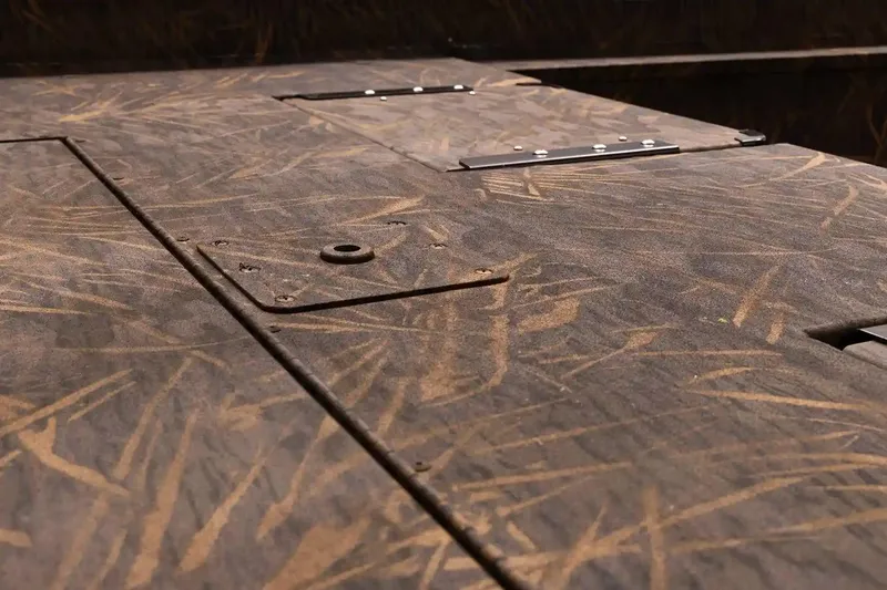 Slide: The Image of 2026 G3 Gator Tough 20 CC boat deck with camo pattern and metal fittings. - 6