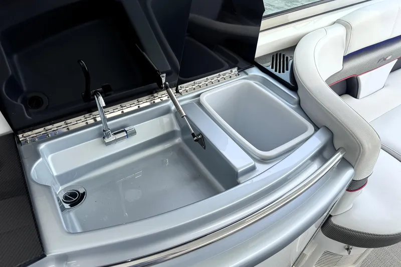 Slide: The Image of 2014 Formula 400 FX8 boat sink and seating area, featuring modern design and functionality. - 11