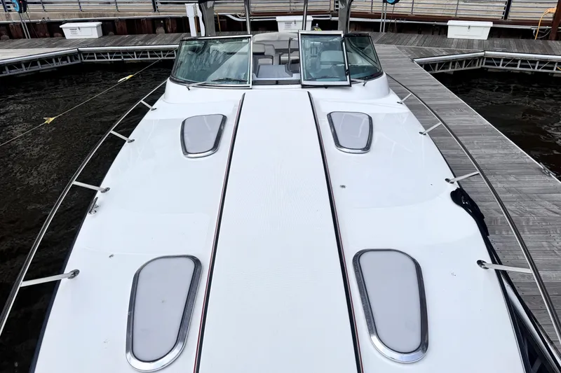 Slide: The Image of 2014 Formula 400 FX8 boat docked at marina, top deck view. - 14
