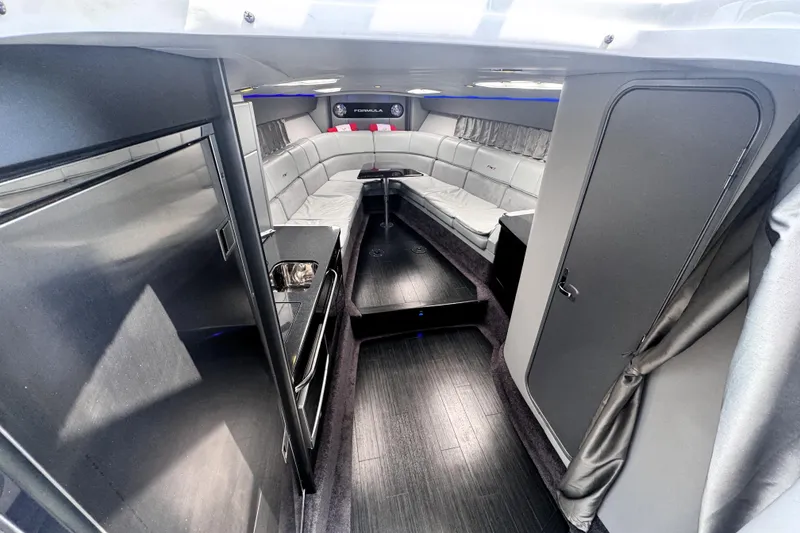 Slide: The Image of Luxurious interior of 2014 Formula 400 FX8 boat with modern seating and sleek design. - 17