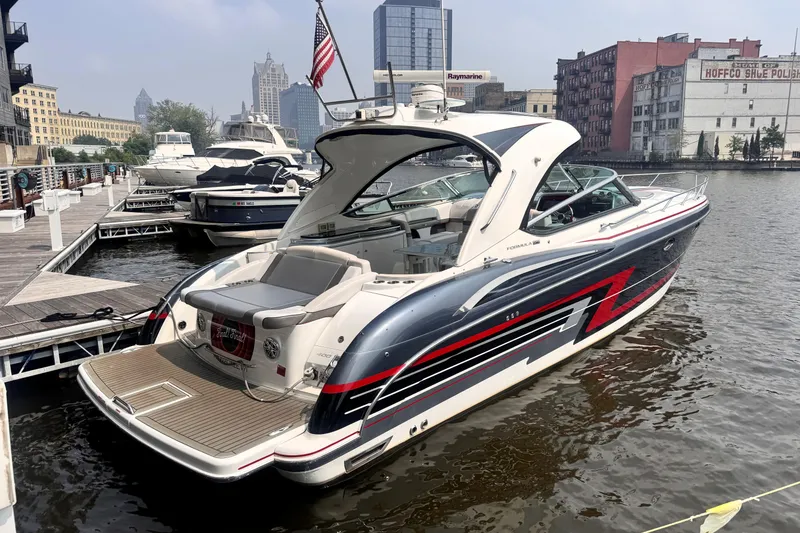 Slide: The Image of Luxury 2014 Formula 400 FX8 yacht docked in urban marina setting. - 2