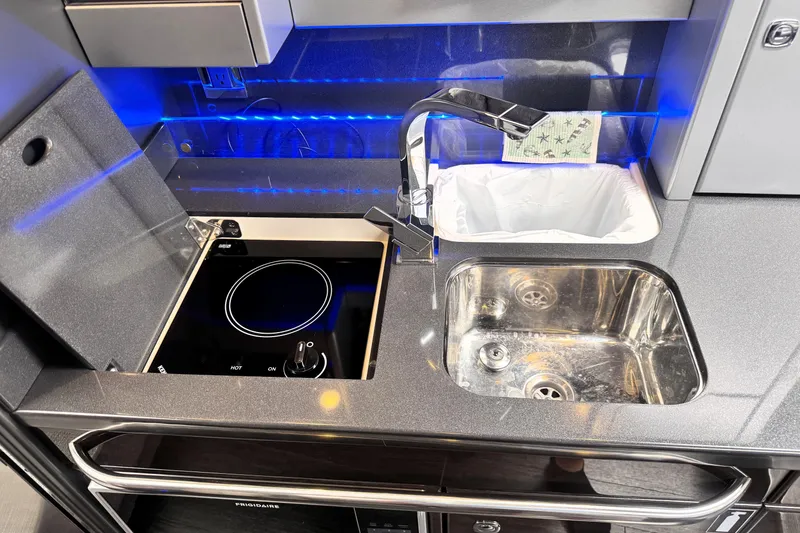 Slide: The Image of Modern kitchen area in 2014 Formula 400 FX8 with sink and induction cooktop. - 20