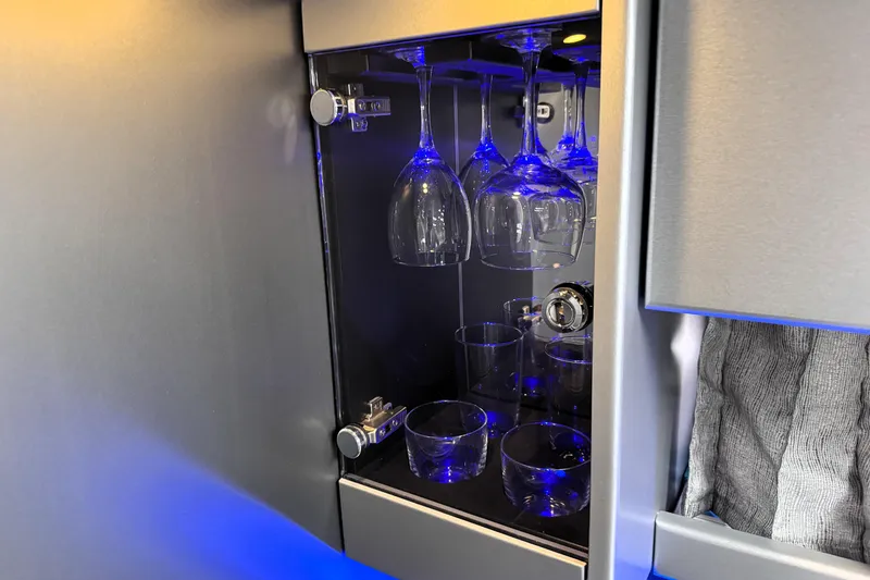 Slide: The Image of Luxury glassware cabinet with blue lighting in 2014 Formula 400 FX8 boat. - 21
