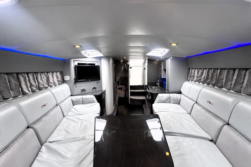 Slide: The Image of Luxurious interior of a 2014 Formula 400 FX8 boat with plush seating and modern amenities. - 26