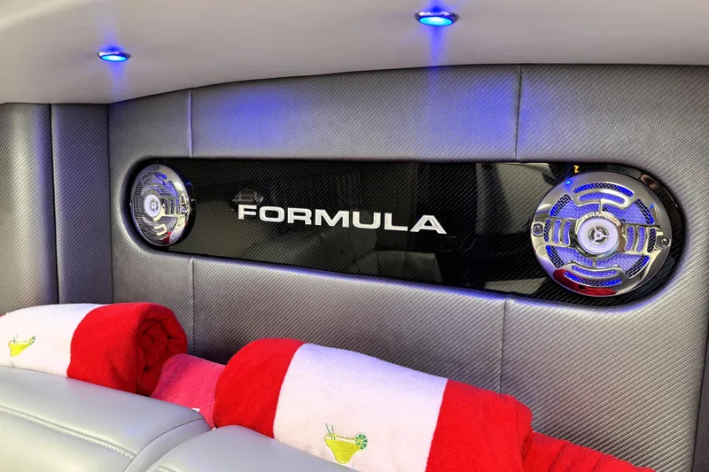 Slide: The Image of 2014 Formula 400 FX8 interior with speakers and red towels, featuring blue LED lighting. - 27
