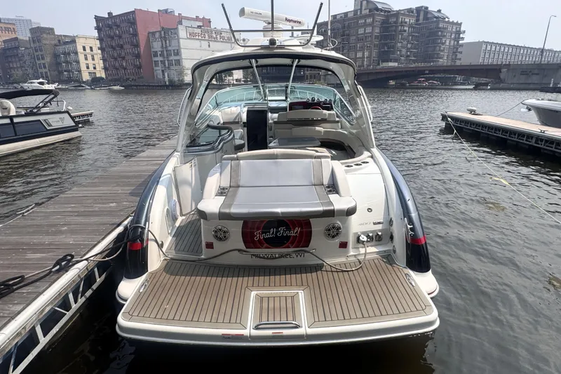 Slide: The Image of 2014 Formula 400 FX8 boat docked in urban marina setting. - 3