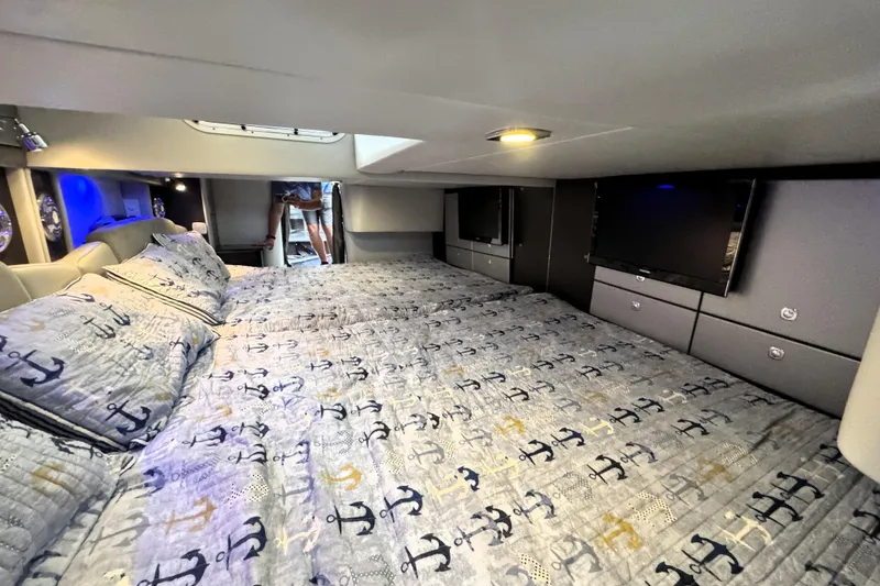 Slide: The Image of Cozy cabin interior of 2014 Formula 400 FX8 with nautical-themed bedding and modern amenities. - 34