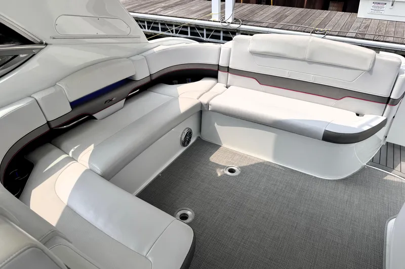 Slide: The Image of Luxurious seating area on a 2014 Formula 400 FX8 boat, featuring sleek white upholstery. - 45
