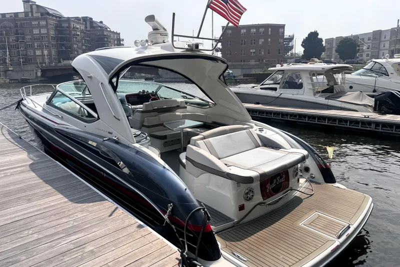 Slide: The Image of 2014 Formula 400 FX8 luxury yacht docked at marina with American flag. - 5