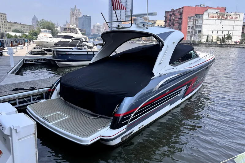 Slide: The Image of 2014 Formula 400 FX8 yacht docked in urban marina, covered and ready for adventure. - 6