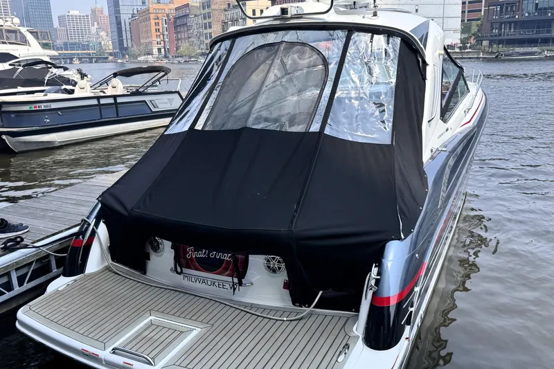 Slide: The Image of 2014 Formula 400 FX8 boat docked in urban marina setting. - 7