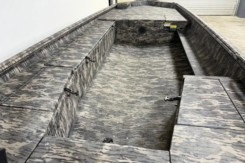 Slide: The Image of 2026 Havoc 1756 MRST boat interior with camouflage design and spacious seating. - 10