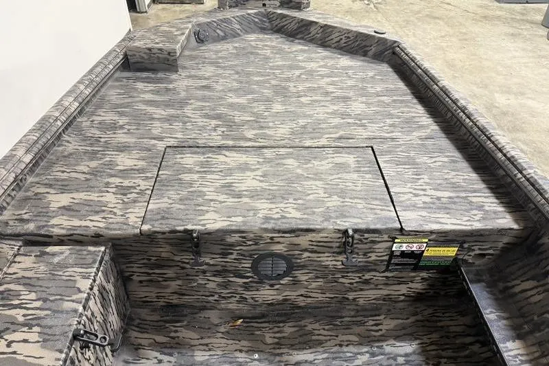 Slide: The Image of 2026 Havoc 1756 MRST boat interior with camouflage pattern and storage compartment. - 11