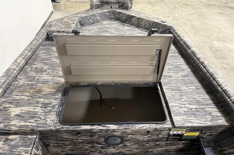 Slide: The Image of 2026 Havoc 1756 MRST boat with open storage compartment, camouflage design. - 12