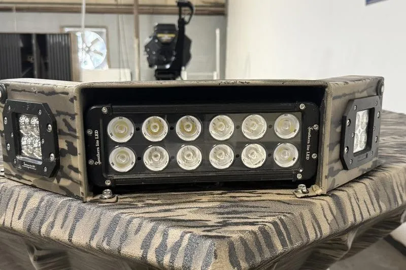 Slide: The Image of 2026 Havoc 1756 MRST boat with LED light bar, camo pattern. - 13