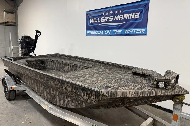 Slide: The Image of 2026 Havoc 1756 MRST boat on trailer at Miller's Marine showroom. - 2