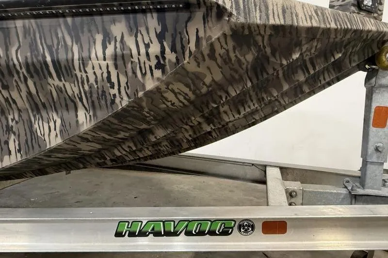 Slide: The Image of Camouflage-patterned 2026 Havoc 1756 MRST boat on a trailer. - 3
