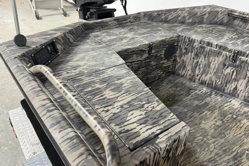 Slide: The Image of 2026 Havoc 1756 MRST boat interior with camouflage pattern and storage compartments. - 6