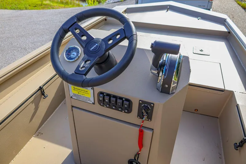Slide: The Image of 2026 Excel Switchblade boat dashboard with steering wheel and control panel. - 14