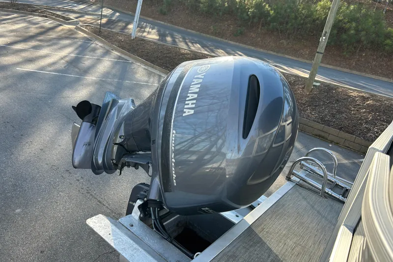 Slide: The Image of 2023 Bennington 22 SSRX with Yamaha outboard motor in parking lot. - 14