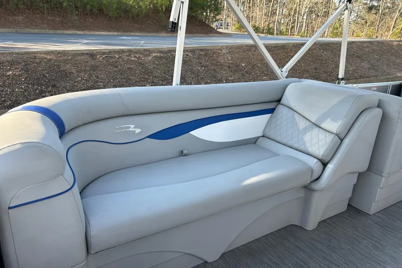 Slide: The Image of 2023 Bennington 22 SSRX boat interior with gray and blue seating. - 16